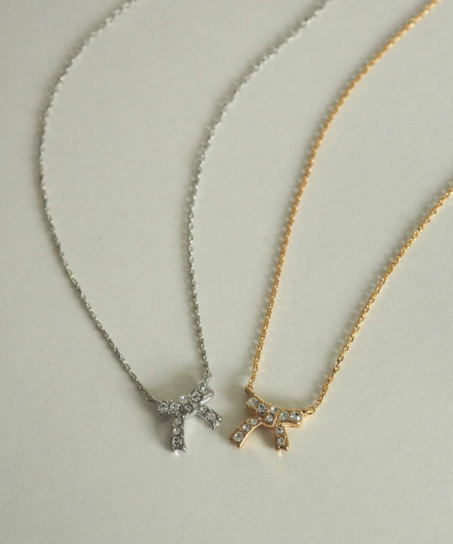 ラインストーンリボンプチペンダント【MUK petite charme】 | 【公式